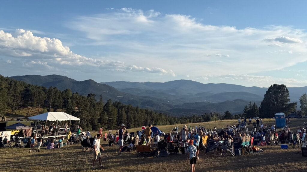 Outdoor community event overlooking the mountains near Genesee, Colorado